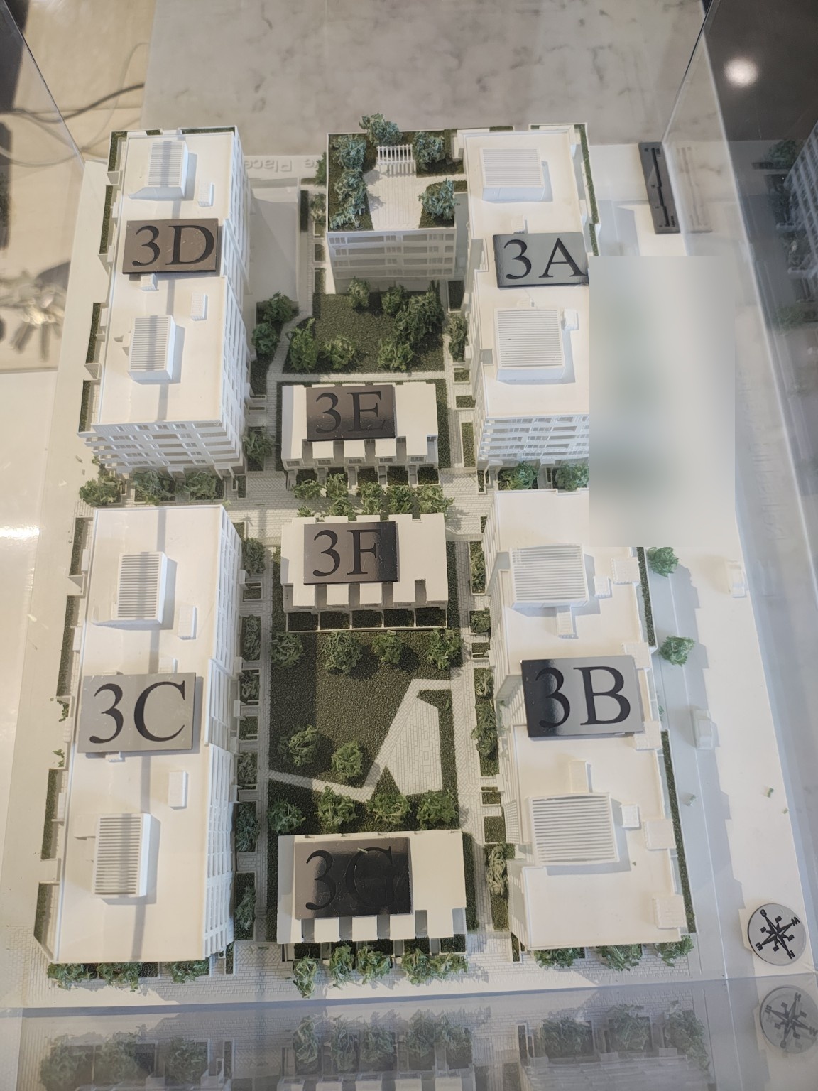 Physical model of a multi-building apartment complex showing multiple buildings and internal routes.